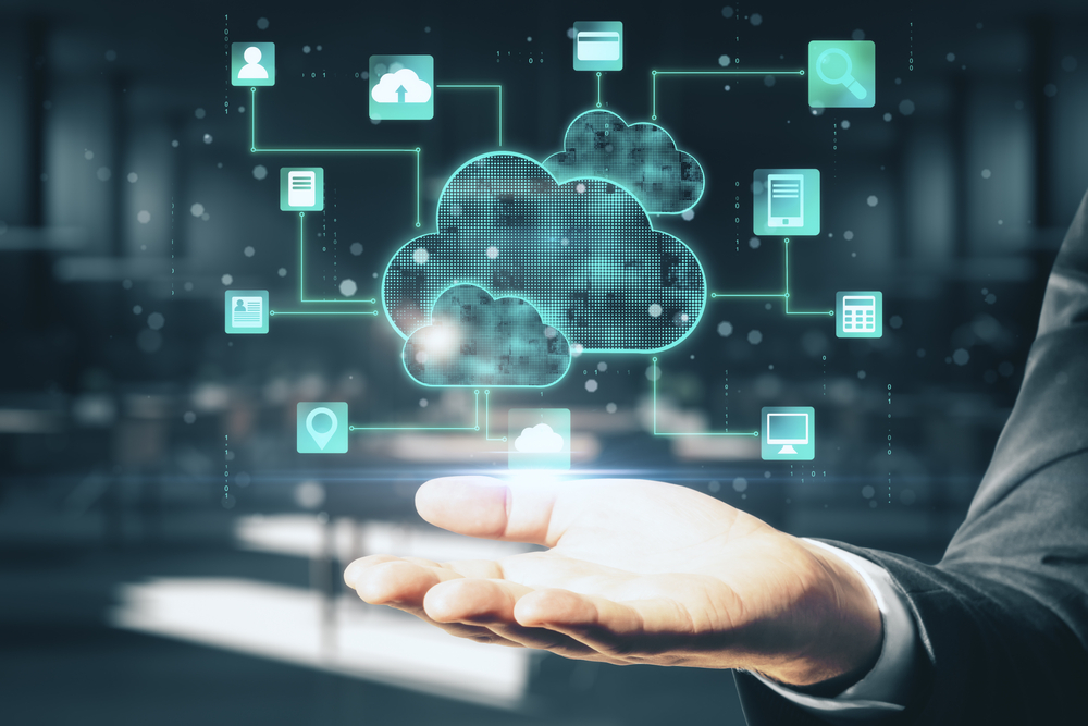 Holographic representation of cloud computing over open businessman's hand