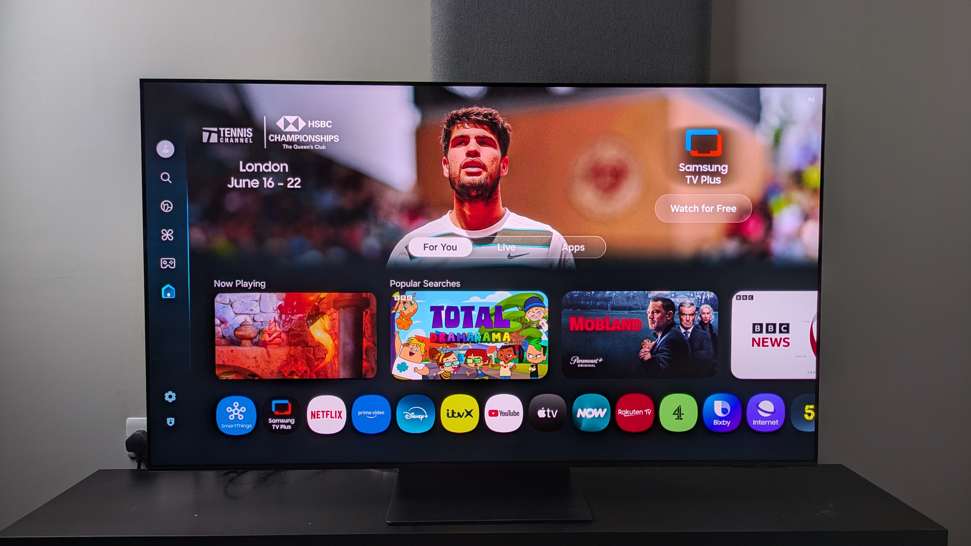Samsung S95F with home screen on page 