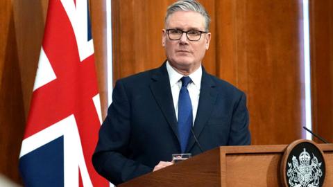 Britain's Prime Minister Keir Starmer listens to questions during a press conference at Downing Street on April 1, 2026 in London, England.