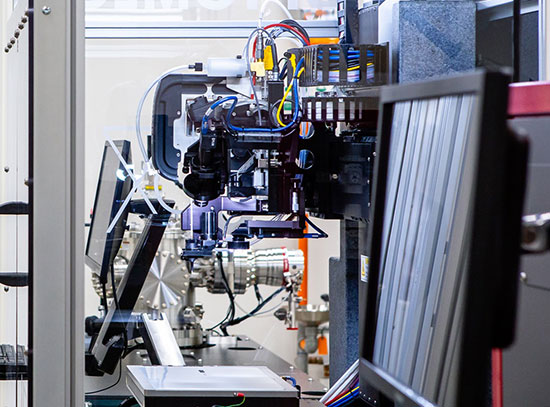 A close-up view of an aerosol jet printer at Argonne National Laboratory, showcasing its intricate c